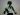 A black and white wall stencil of Bruce Lee in a fighting stance