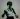A black and white wall stencil of Bruce Lee in a fighting stance