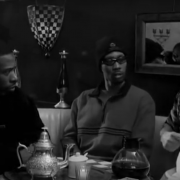 Bill Murray sits at a table with two members of The Wu-Tang Clan drinking coffee from a scene in film Coffee and Cigarettes