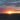 Picture of a sunset on Ainsdale beach. The sky is glowing below deep blue clouds