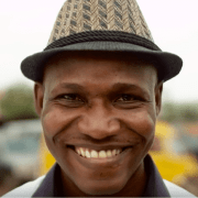 The world scrabble champion Wellington Jighere looks into the camera