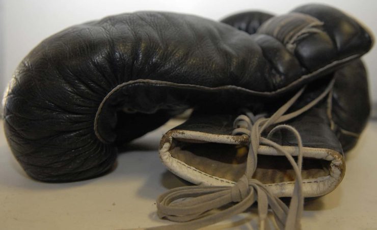A big pair of black boxing gloves