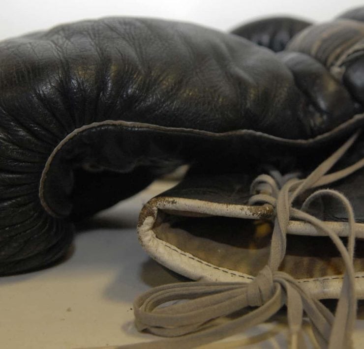 A big pair of black boxing gloves