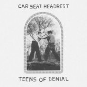 The album cover for teens of denial by Car Seat Headrest, featuring a black and white photo of two teens fighting
