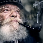 Man with beard, pipe & flat cap