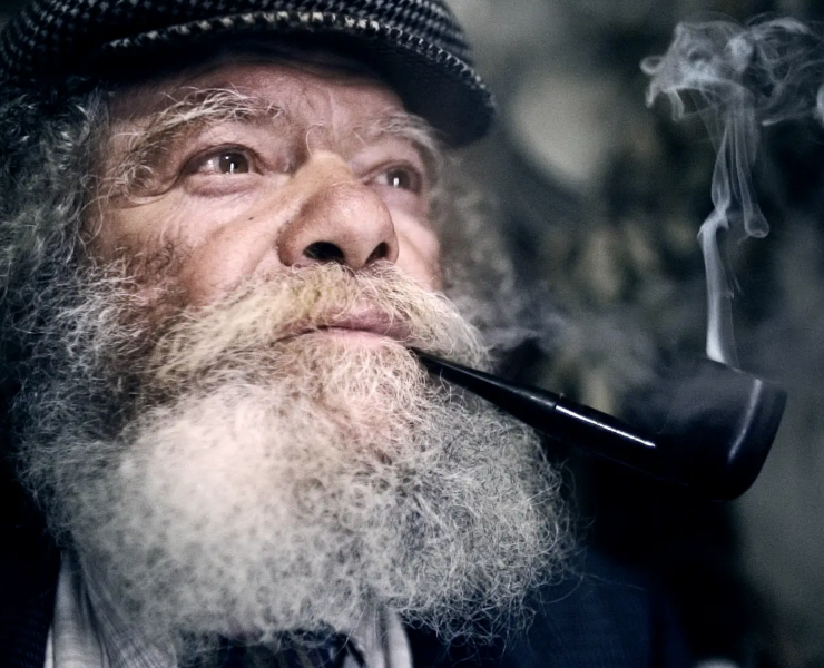 Man with beard, pipe & flat cap