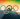 5 coloured Olympic rings with The Christ statue in Rio visible through them