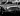 A shiny Astin Martin DB5 photographed in black and white