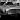 A shiny Astin Martin DB5 photographed in black and white