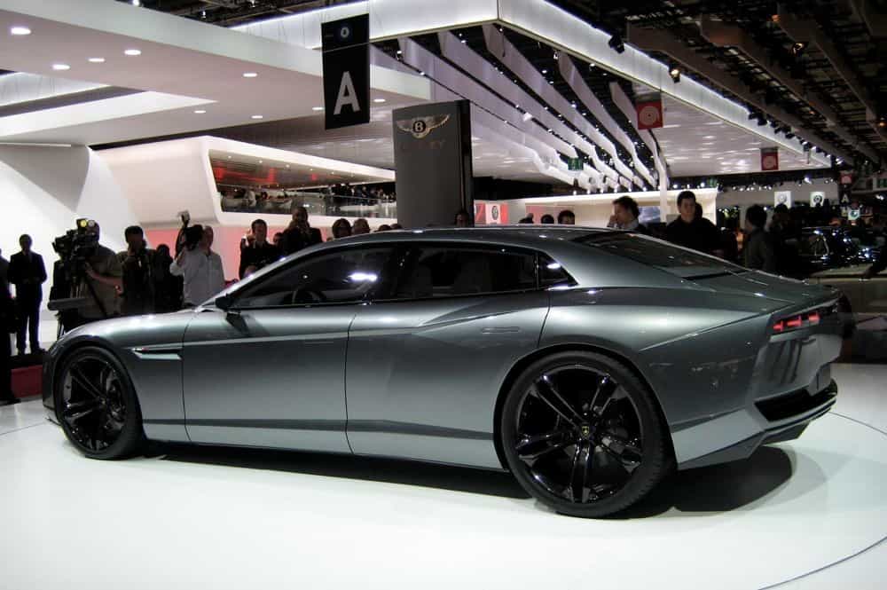 A showroom with a parked matt grey Lambourghini