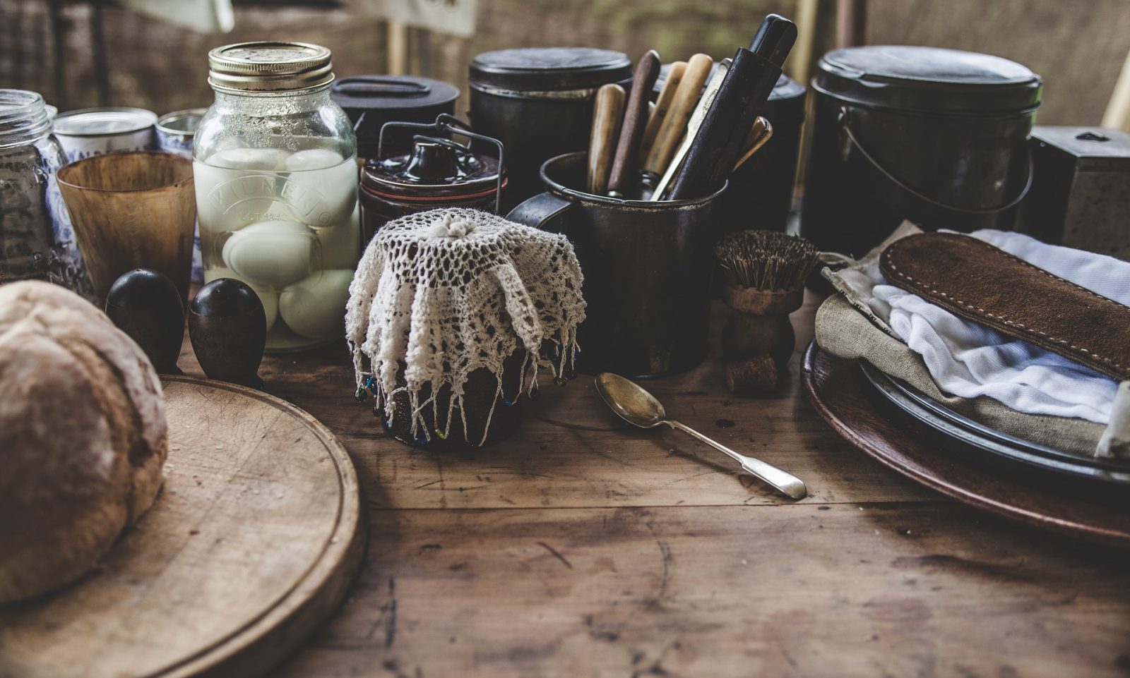 Cutlery and condiments on a wooden table