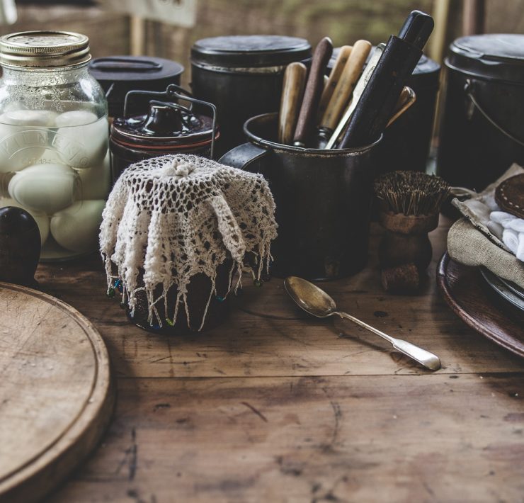 Cutlery and condiments on a wooden table