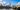 The Palace Of Westminster with Big Ben in centre of shot. Taken from opposite side of Thames