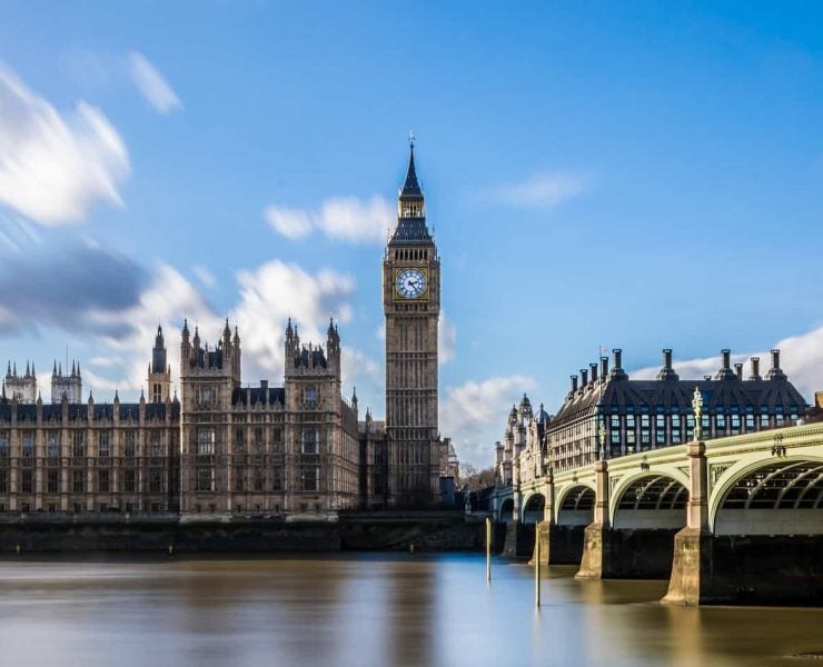 The Palace Of Westminster with Big Ben in centre of shot. Taken from opposite side of Thames