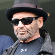 Goodfellas star Joe Pesci wearing shades and a pork pie hat