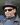 Goodfellas star Joe Pesci wearing shades and a pork pie hat