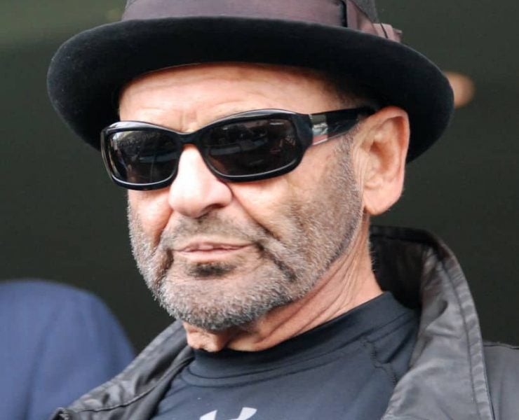 Goodfellas star Joe Pesci wearing shades and a pork pie hat