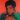 Muhammed Ali as painted by Andy Warhol in 1978. The picture is coloured red with Ali's features black and his fists green