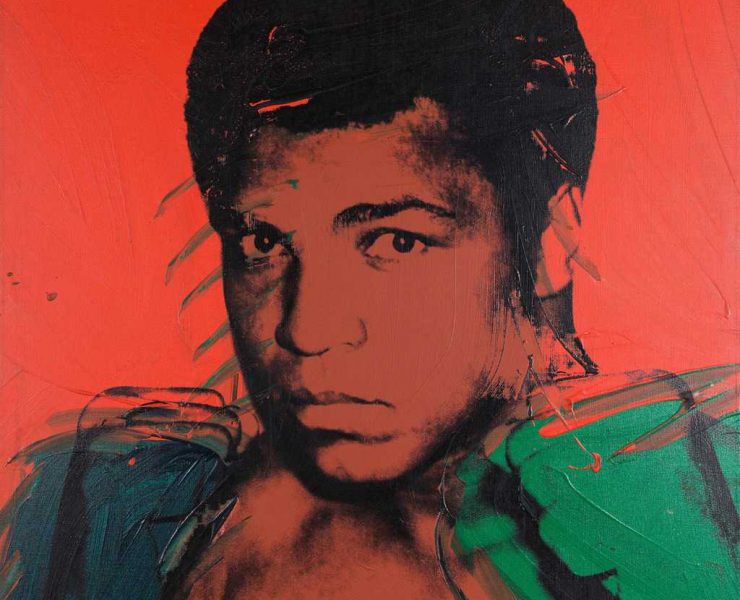 Muhammed Ali as painted by Andy Warhol in 1978. The picture is coloured red with Ali's features black and his fists green