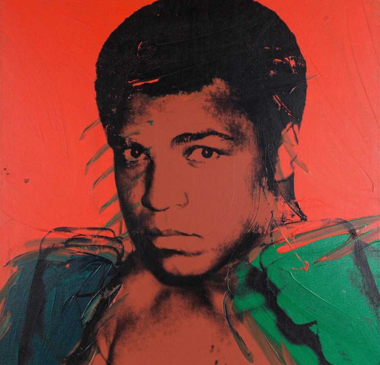 Muhammed Ali as painted by Andy Warhol in 1978. The picture is coloured red with Ali's features black and his fists green