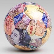 Football covered in english banknotes