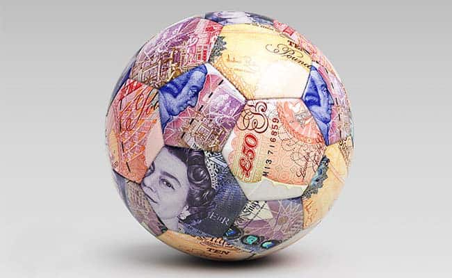 Football covered in english banknotes