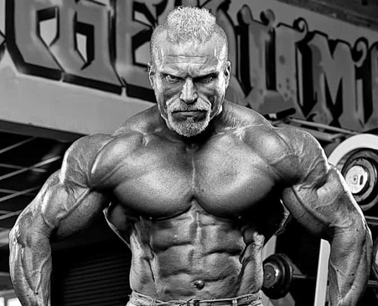 Barny Du Pledsis flexing muscles topless