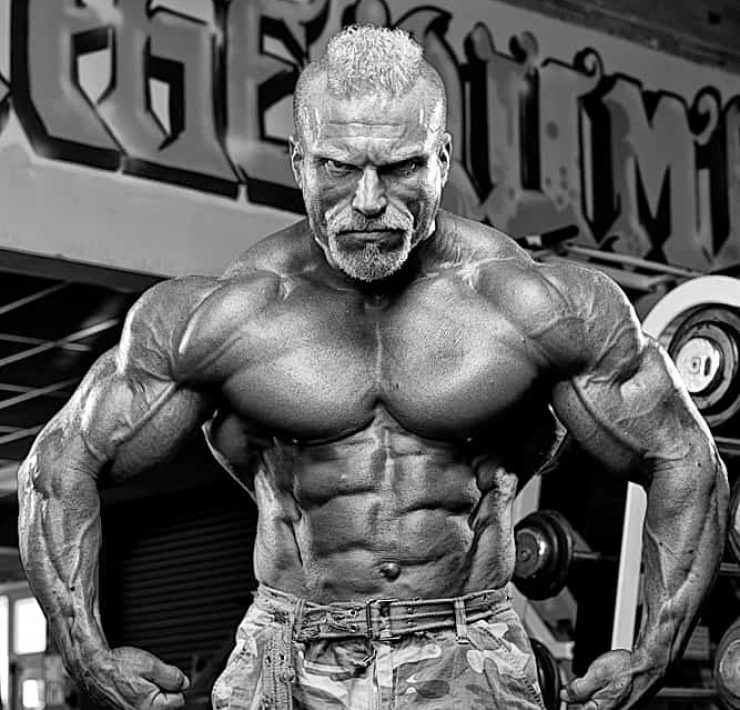 Barny Du Pledsis flexing muscles topless