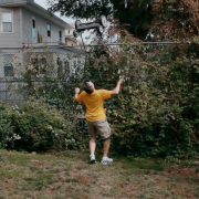 Man with most world records balances a lawnmower on his chin