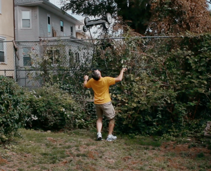 Man with most world records balances a lawnmower on his chin