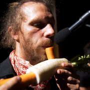 Man from vegetable orchastra 'playing' a carrot