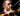 Man from vegetable orchastra 'playing' a carrot