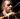 Man from vegetable orchastra 'playing' a carrot