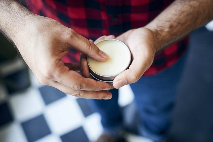 Man holding beard balm
