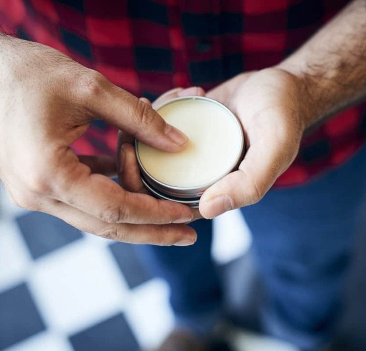 Man holding beard balm