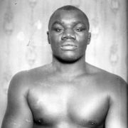 Boxer sam Langford with arms crossed