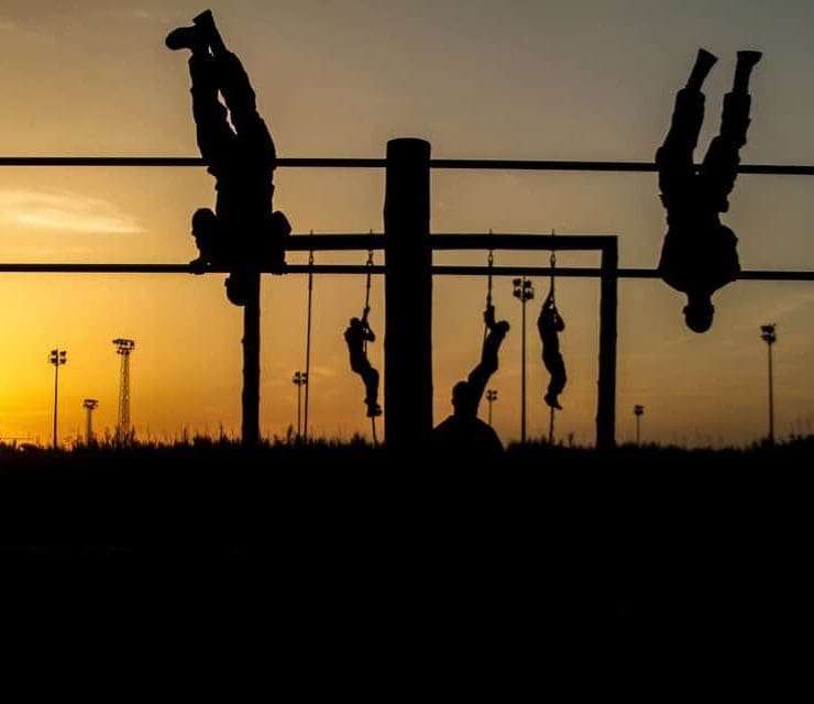 Soldiers negotiate an obstacle course at dusk