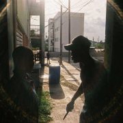A man in an alleyway with a knife photographed in Kingston by Boogie