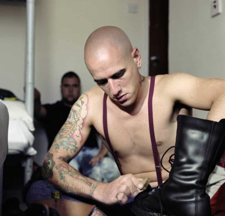 Skinhead shining boots by Photographer Owen Harvey