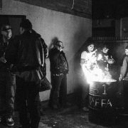Hell's Angels members standing around a fire in a barrel by photographer Andrew Shaylor