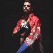 Fighter Ognjen Topic draped in a flag