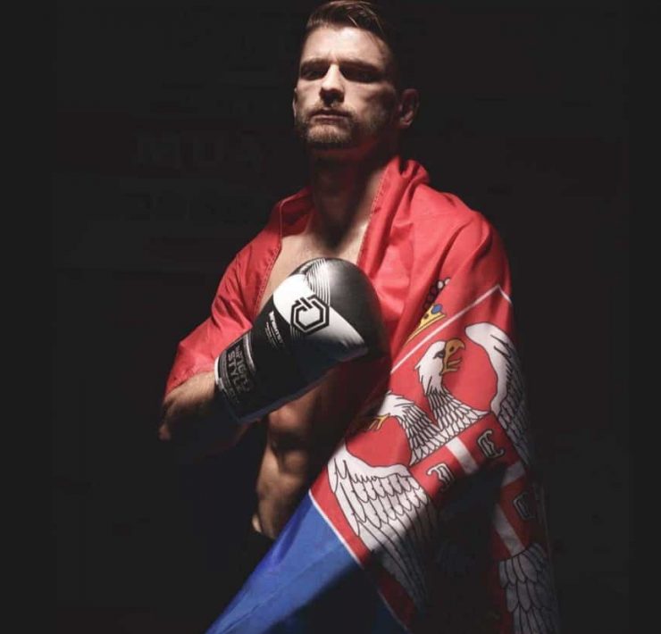 Fighter Ognjen Topic draped in a flag