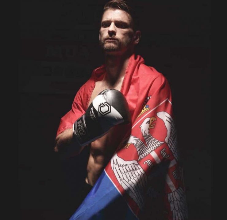 Fighter Ognjen Topic draped in a flag