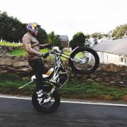 Dougie Lampkin attempting to wheelie full TT Course