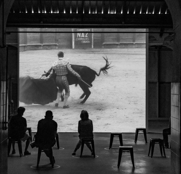 watching footinge of a bullfighter on a screen