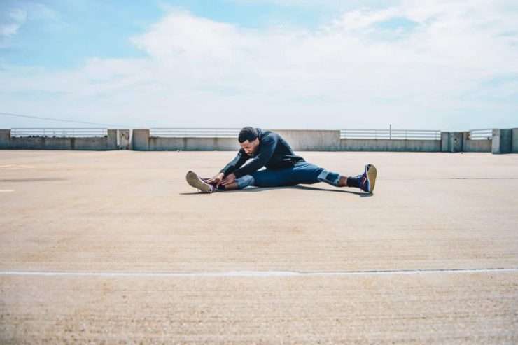 Man stretching after workout