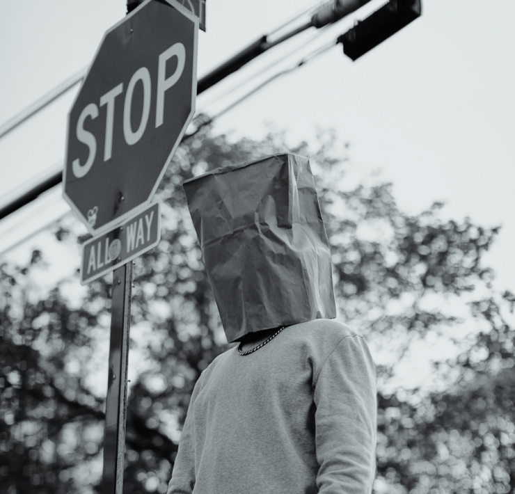 man with paper bag on his head