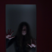 spooky woman behind window