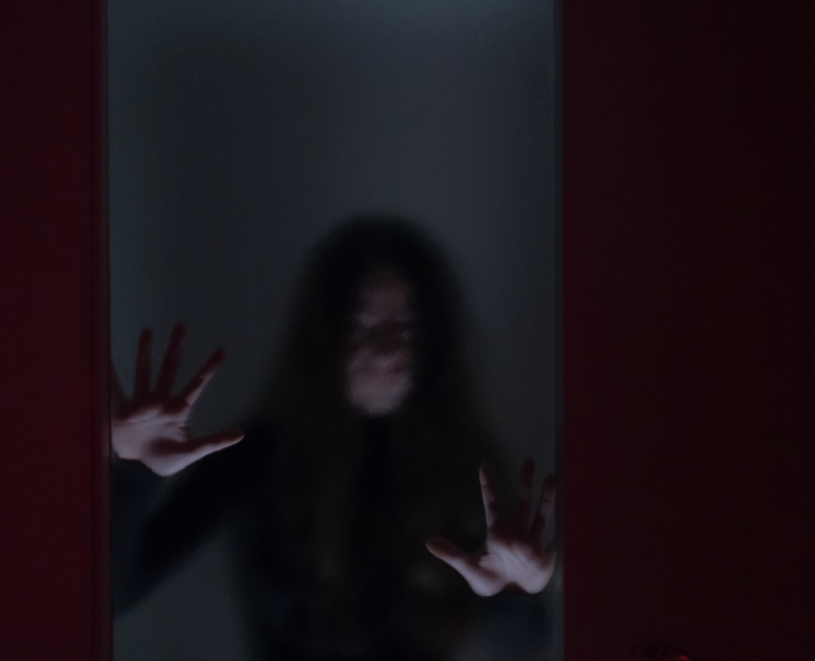 spooky woman behind window