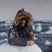 A model rests on a piece of ice during a photoshoot for Gandys London